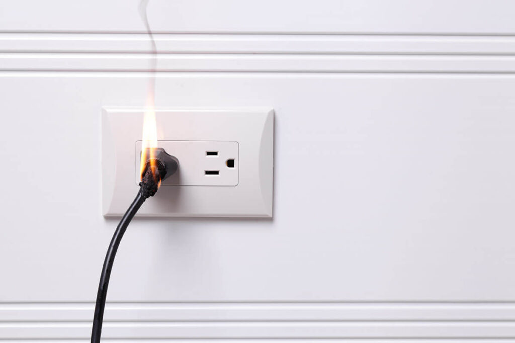 fire on cord in electrical outlet